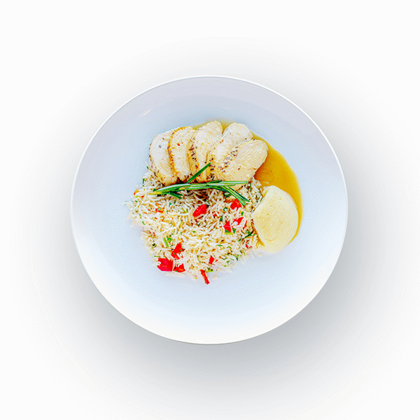 Grilled chicken breast and salmon filet in lemon rosemary sauce with bell pepper rice pilaf and parsnip purée, inspired by French countryside cuisine.