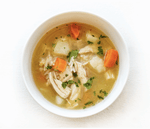 Steaming bowl of Epicured's Low FODMAP Chicken & Rice Soup with tender chicken pieces, basmati rice, and fresh herbs