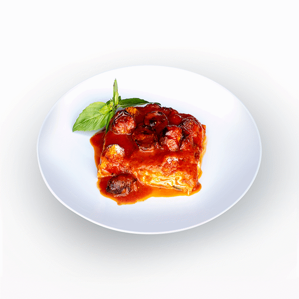 Plate of Epicured's vegetarian Lasagna Alessandra with brown rice noodles, layers of zucchini, mozzarella, basil, and house-made pomodoro sauce.